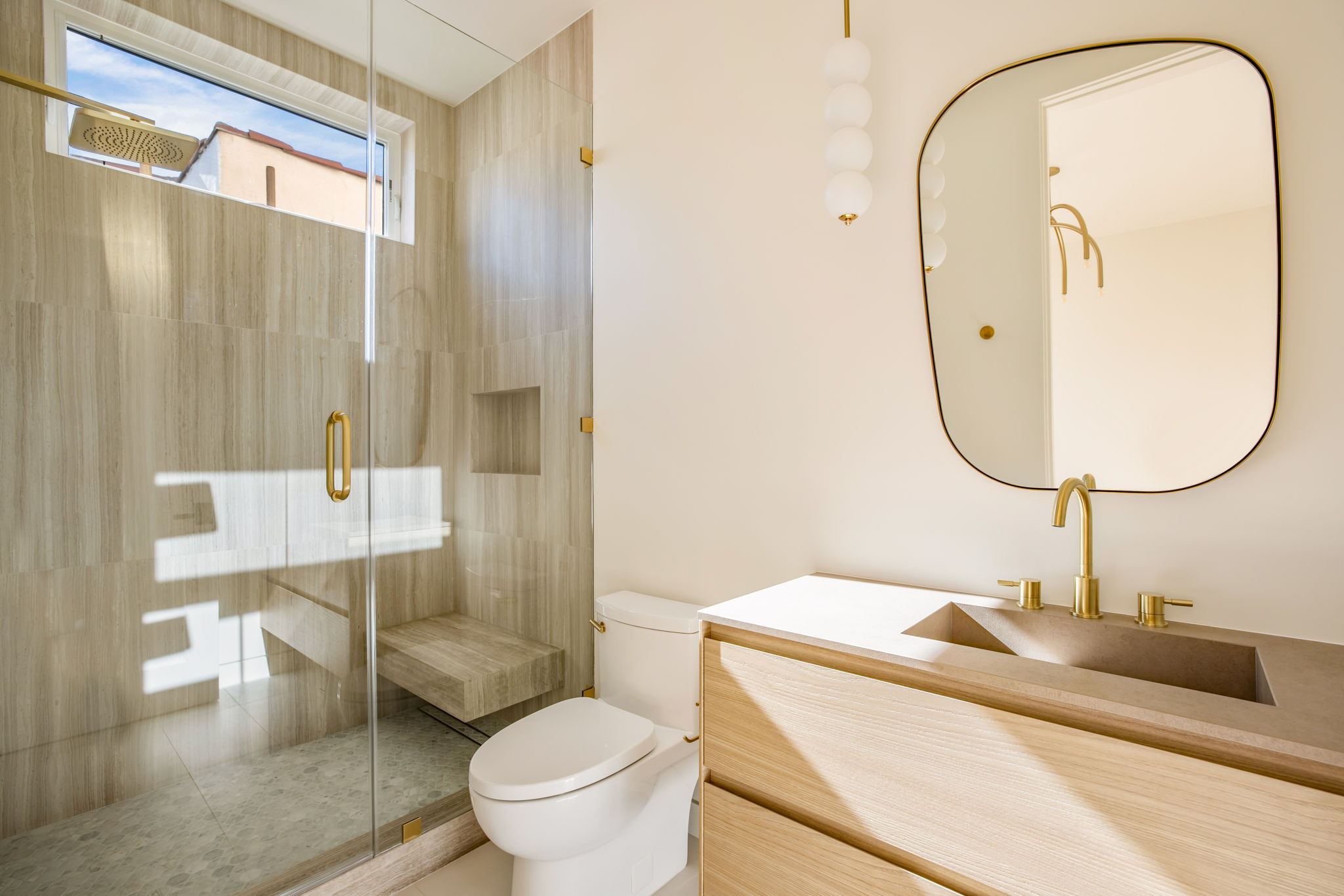 The Alder House guest bath shower with bubble glass pendant lighting