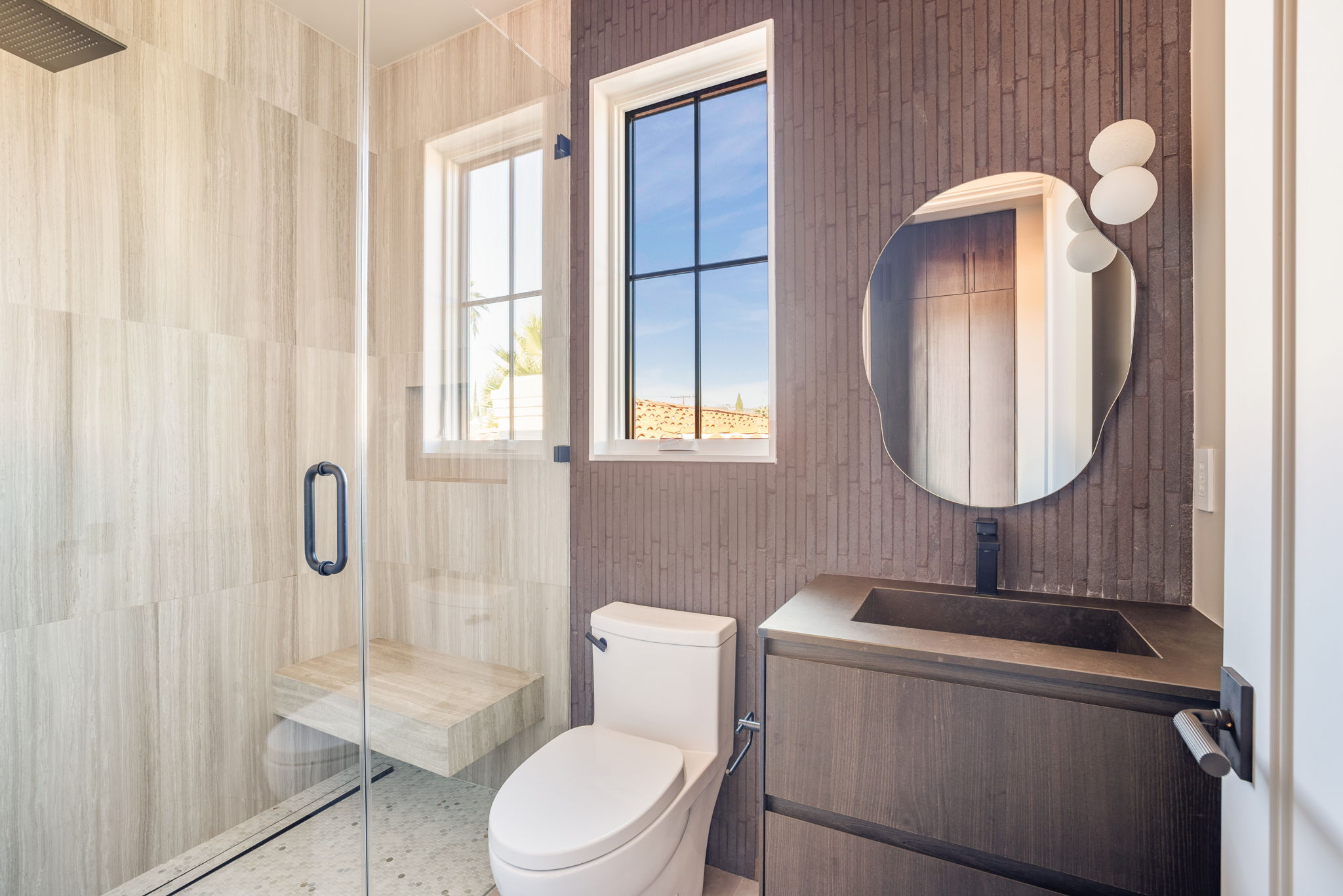 The Alder House guest bath shower with clay tile and window
