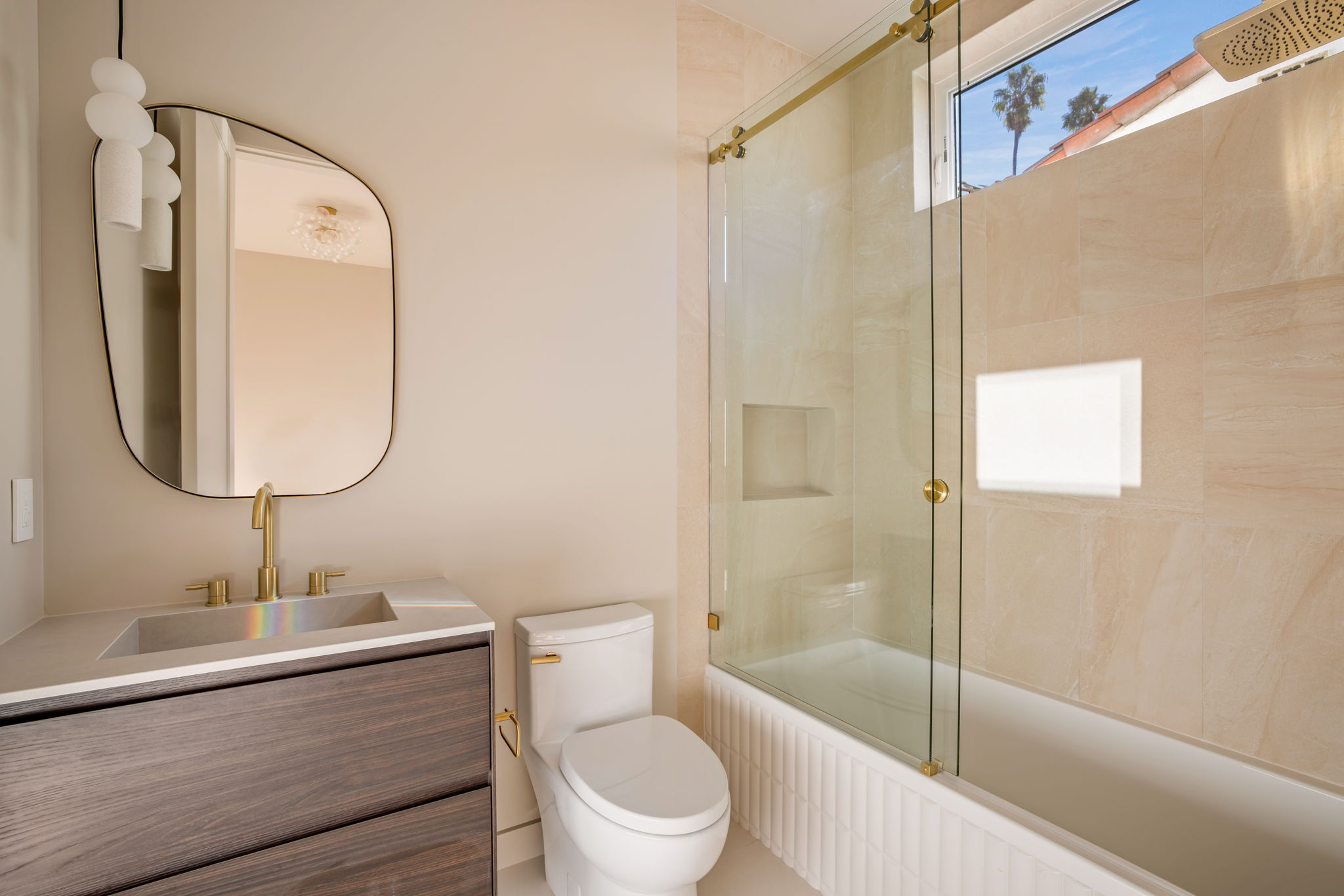 The Alder House guest bath with tub and glass shower enclosure