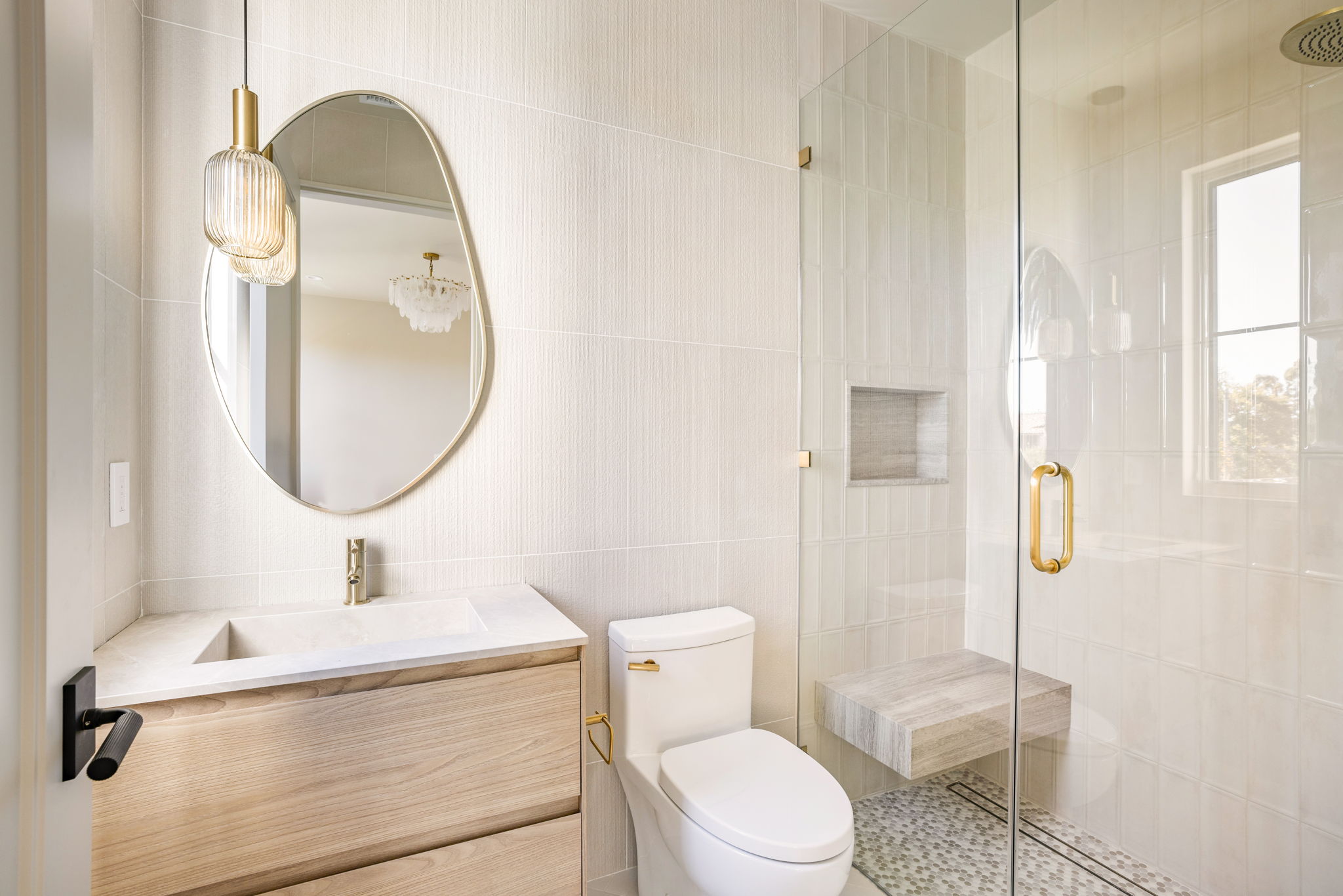 The Alder House primary bath glass shower with bench