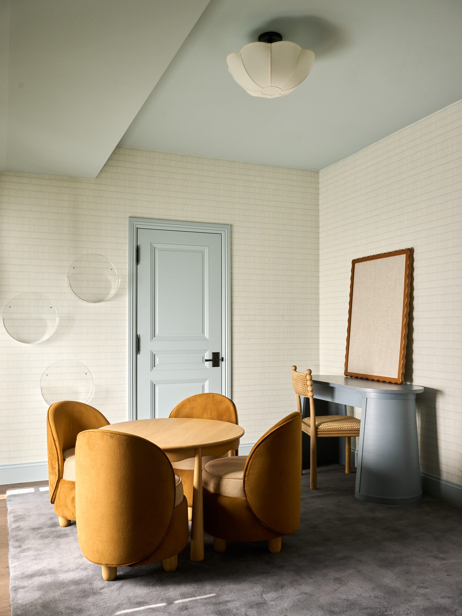 Blue Laurel playroom with mustard velvet chairs