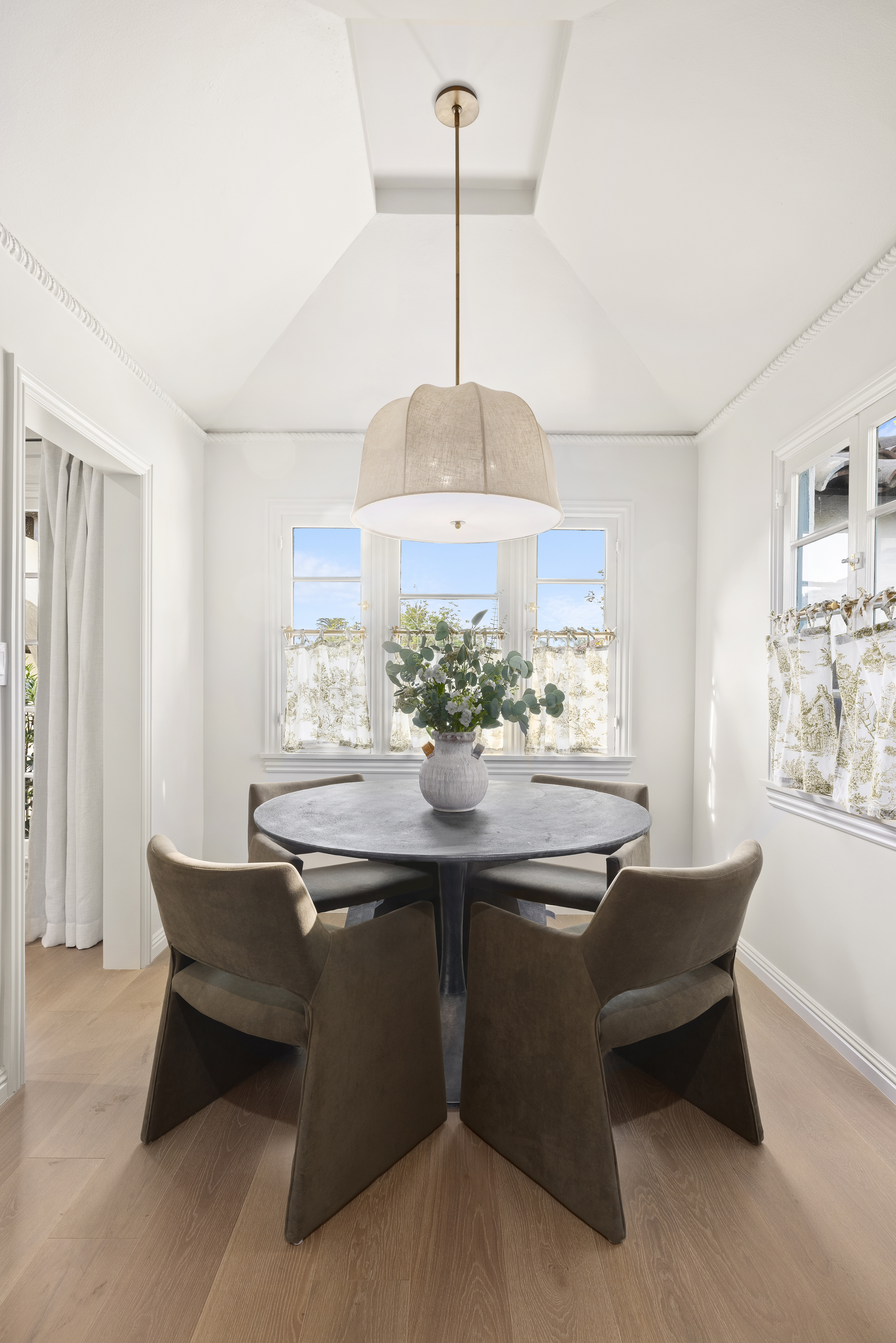 Casa Lista breakfast nook with round table and linen pendant light