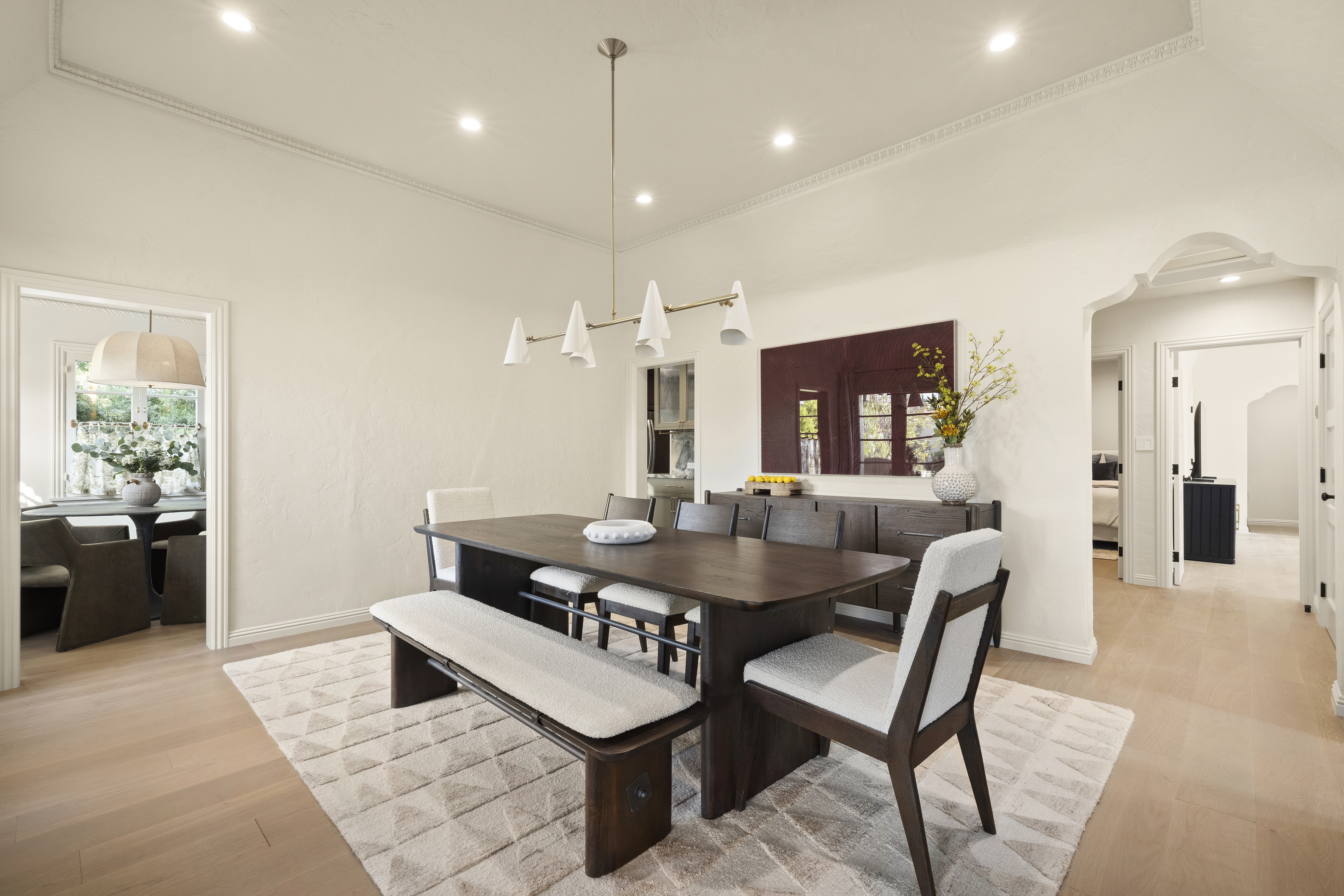 Casa Lista dining room with dark wood table and bench seating