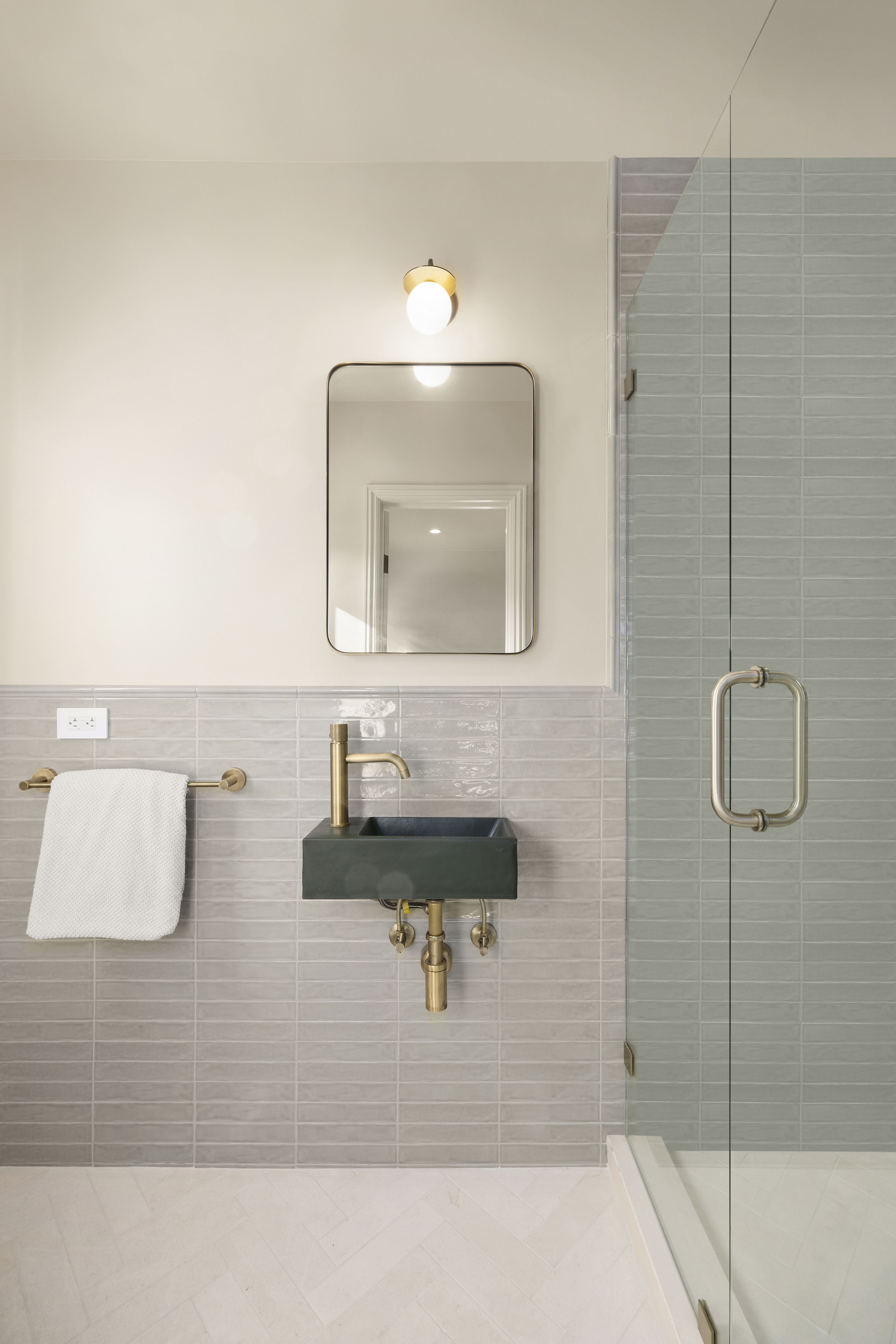 Casa Lista guest bath with grey tile and wall-mount sink