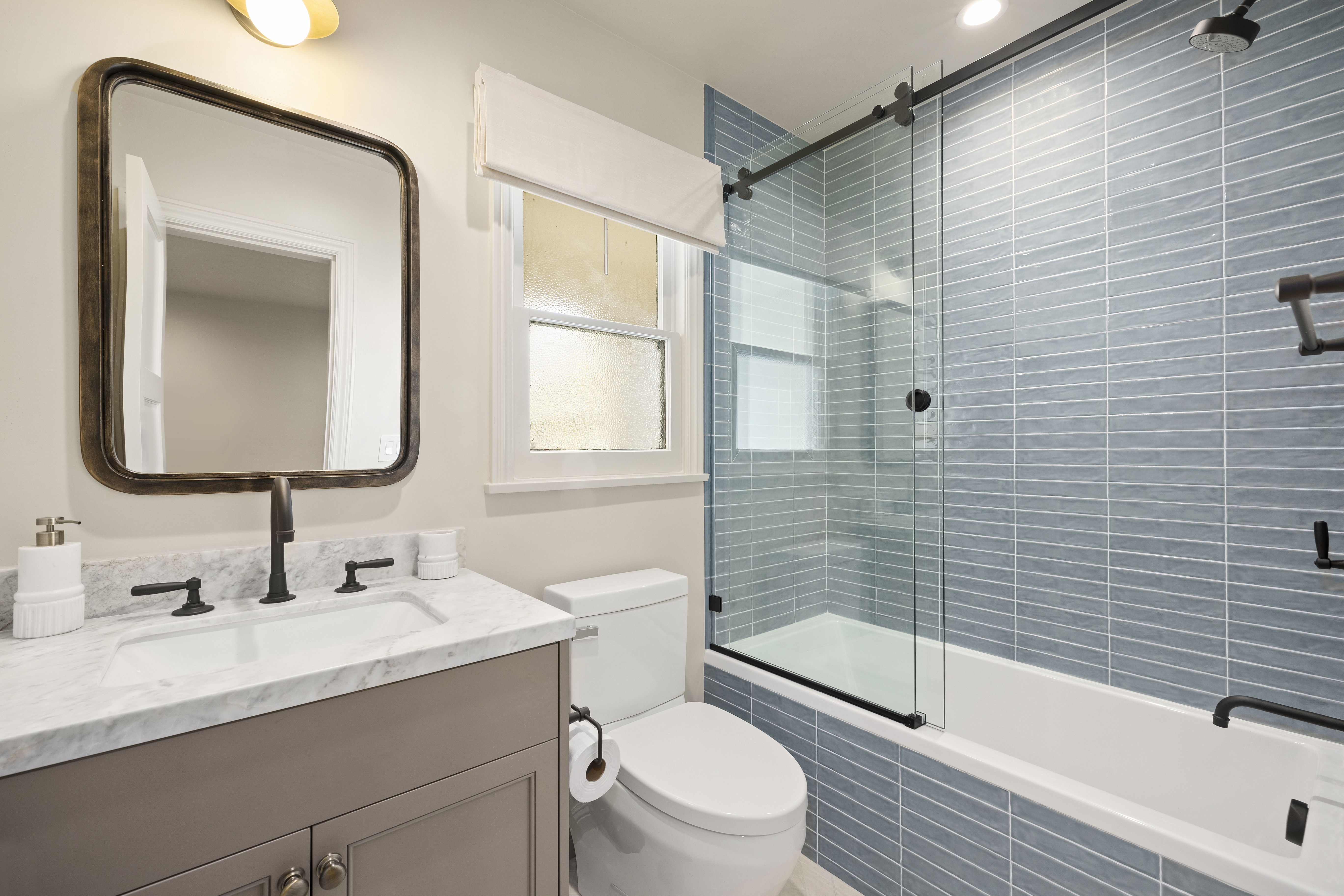 Casa Lista hall bath with blue tile tub and shower