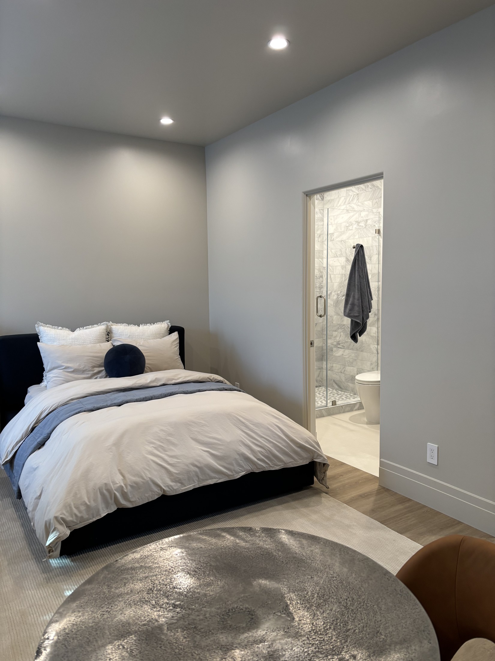 The Coach House bedroom with ensuite bath beyond