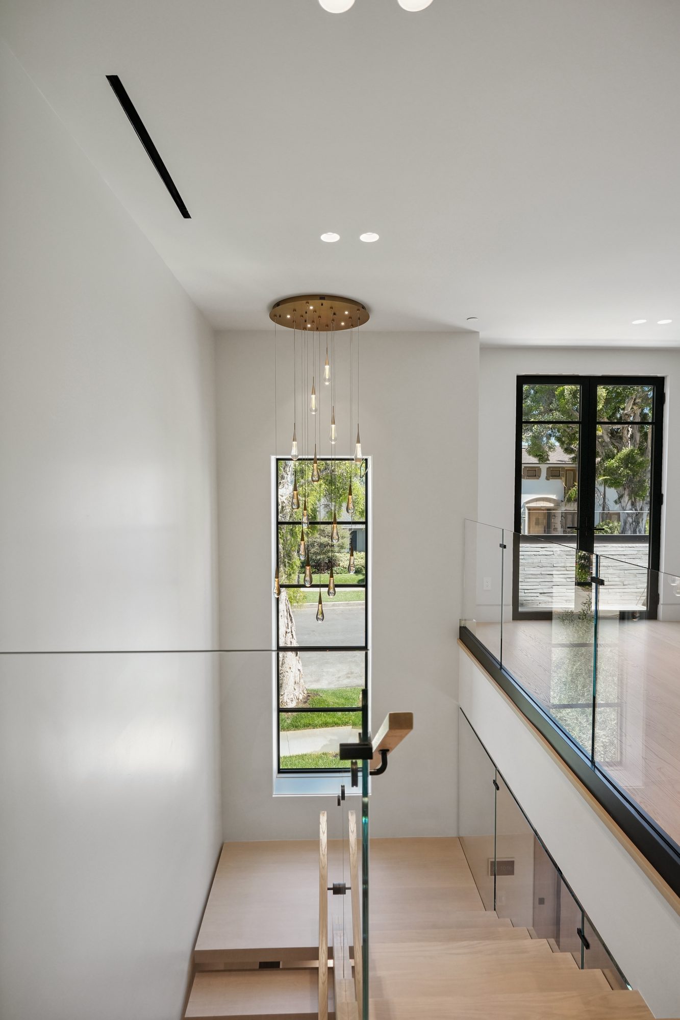 The Form House white walk-in closet with mirror