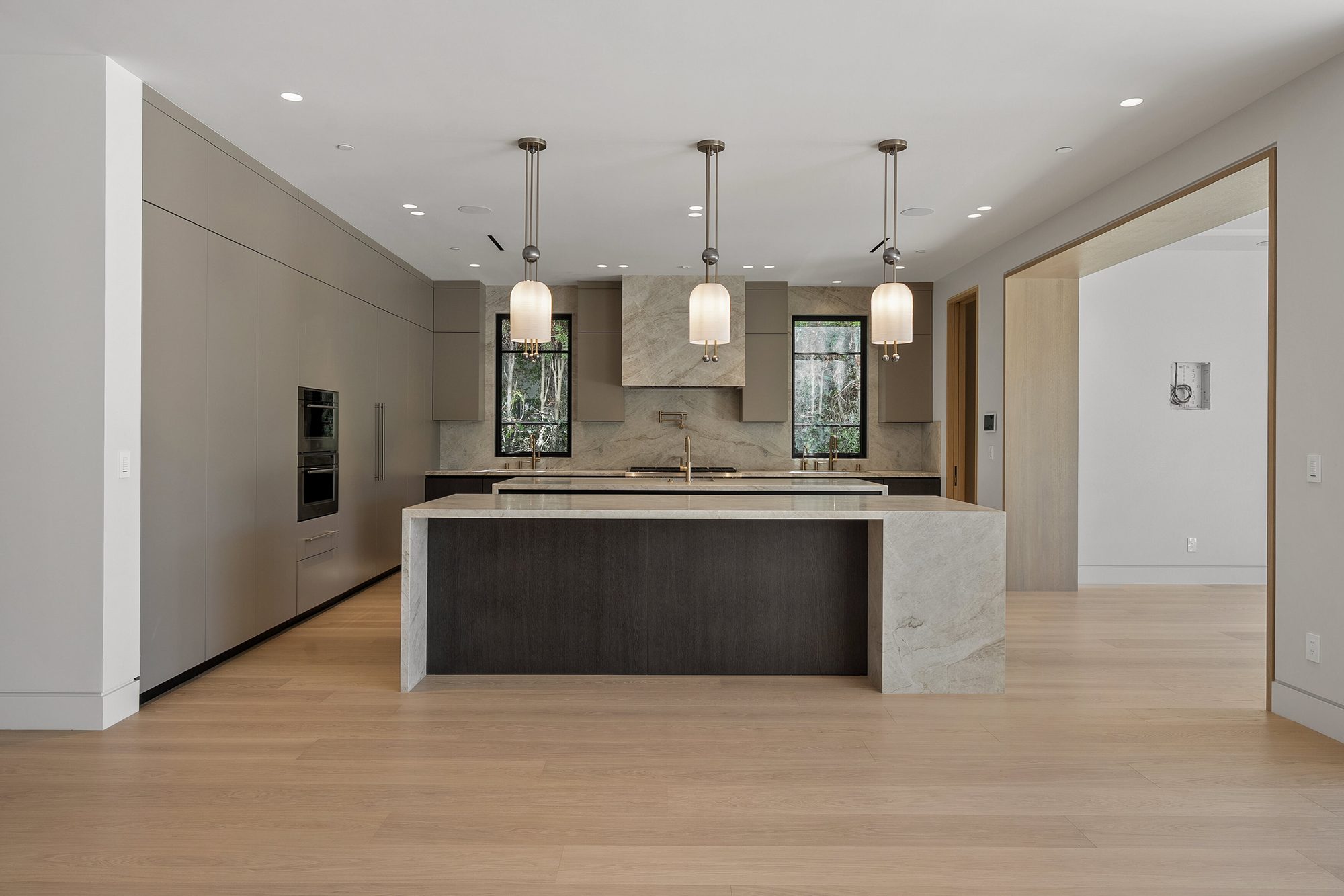 The Form House kitchen with waterfall marble island