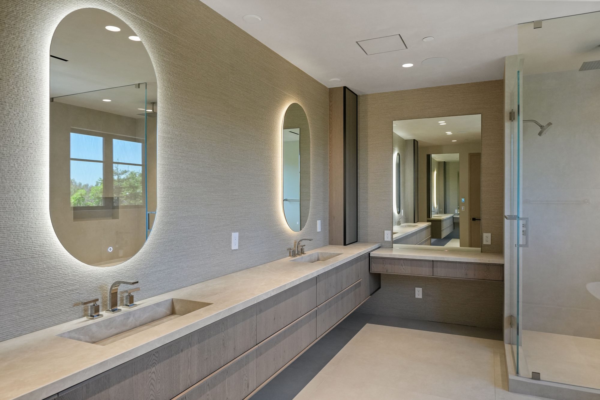 The Form House laundry room with stacked washer and dryer