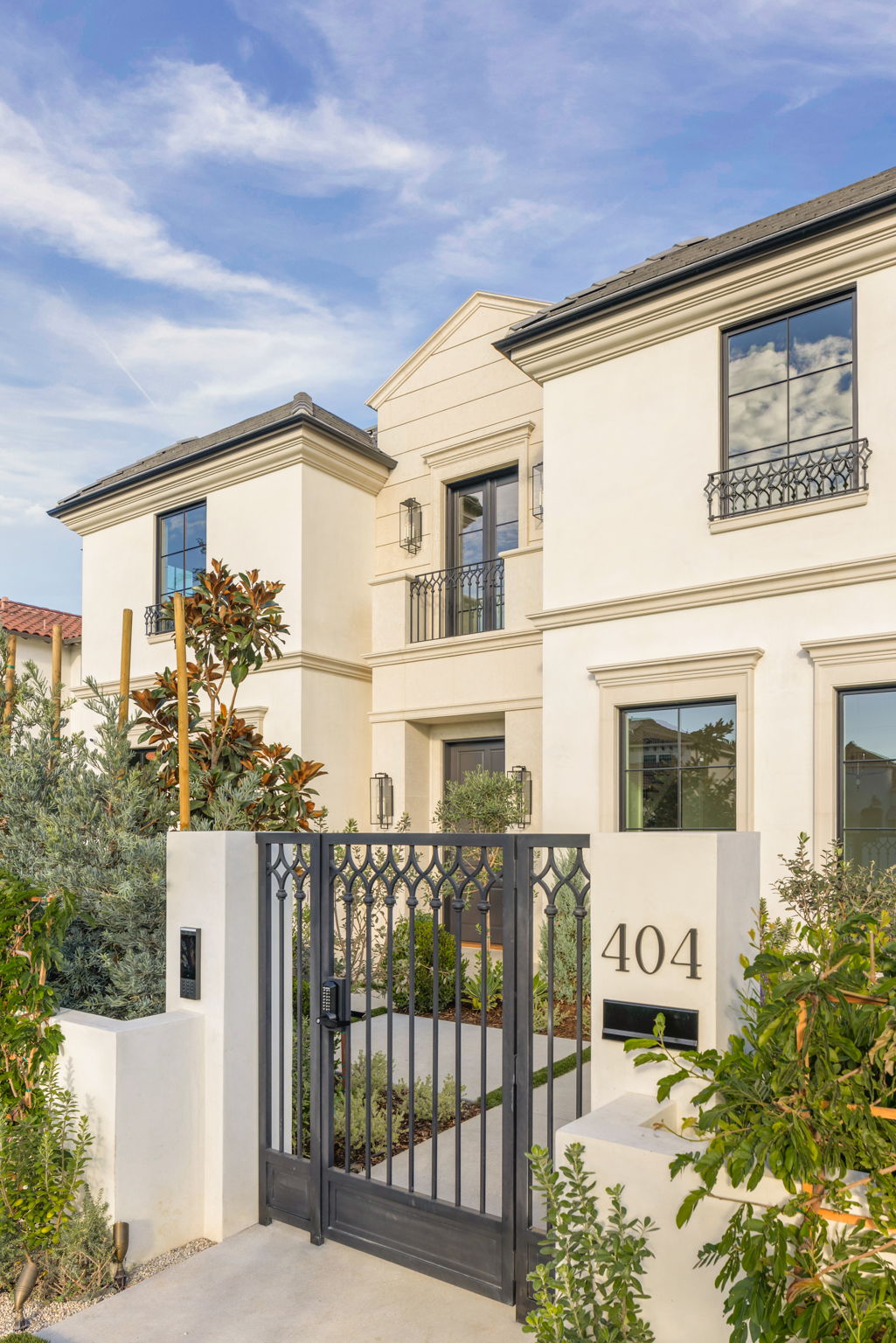 The Magnolia House entry gate with address numbers