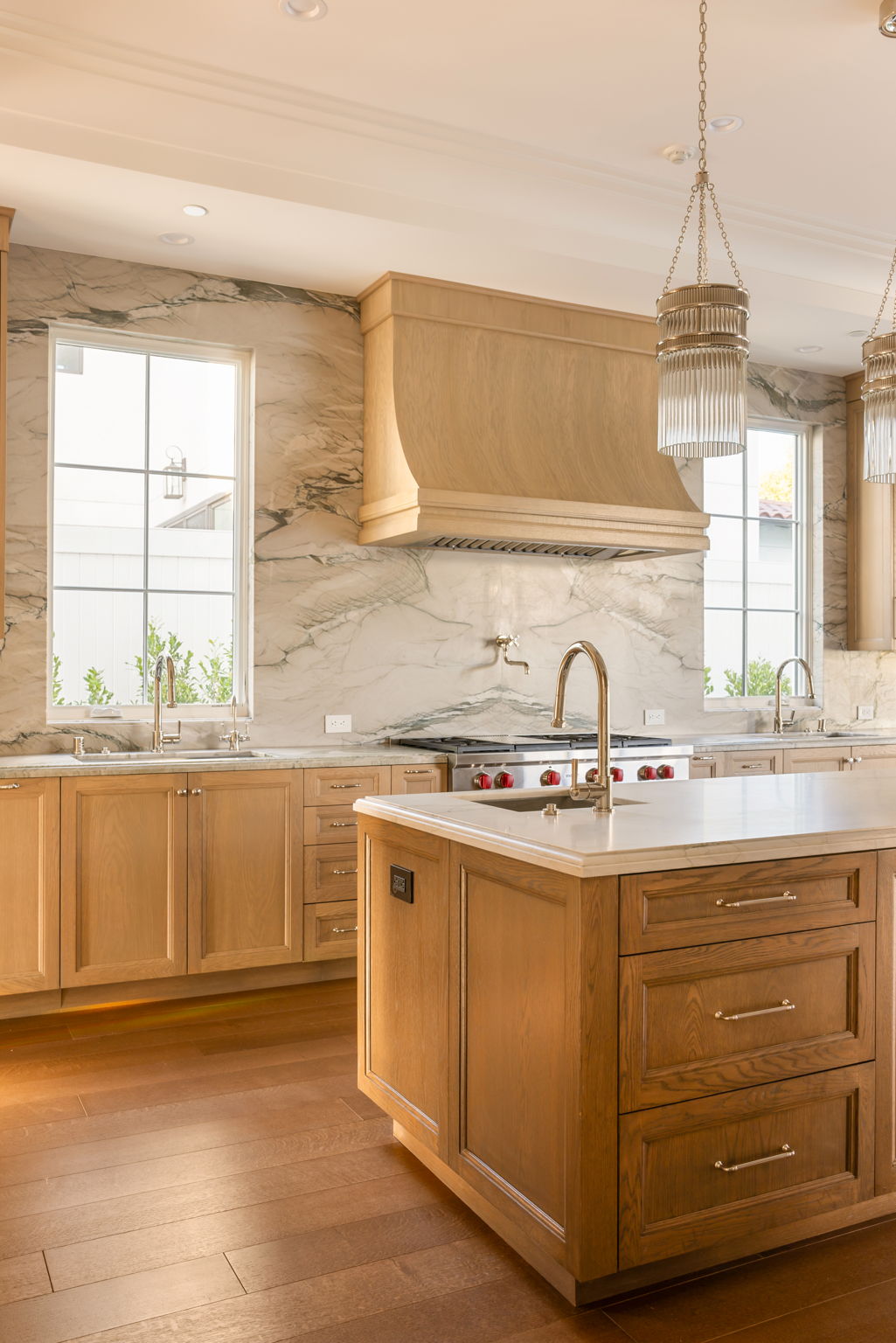The Magnolia House kitchen with oak cabinetry and marble backsplash