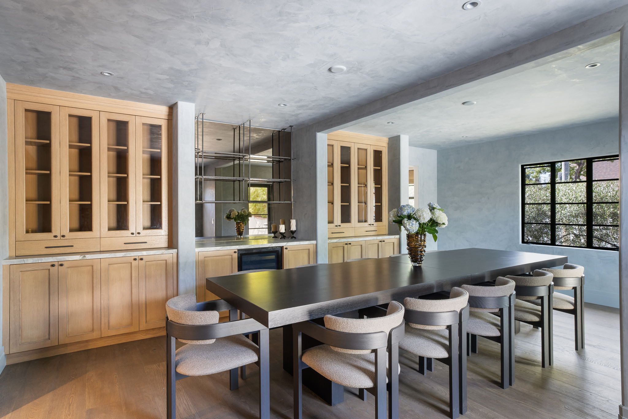 Slate & Sky dining room with wet bar and glass-front millwork