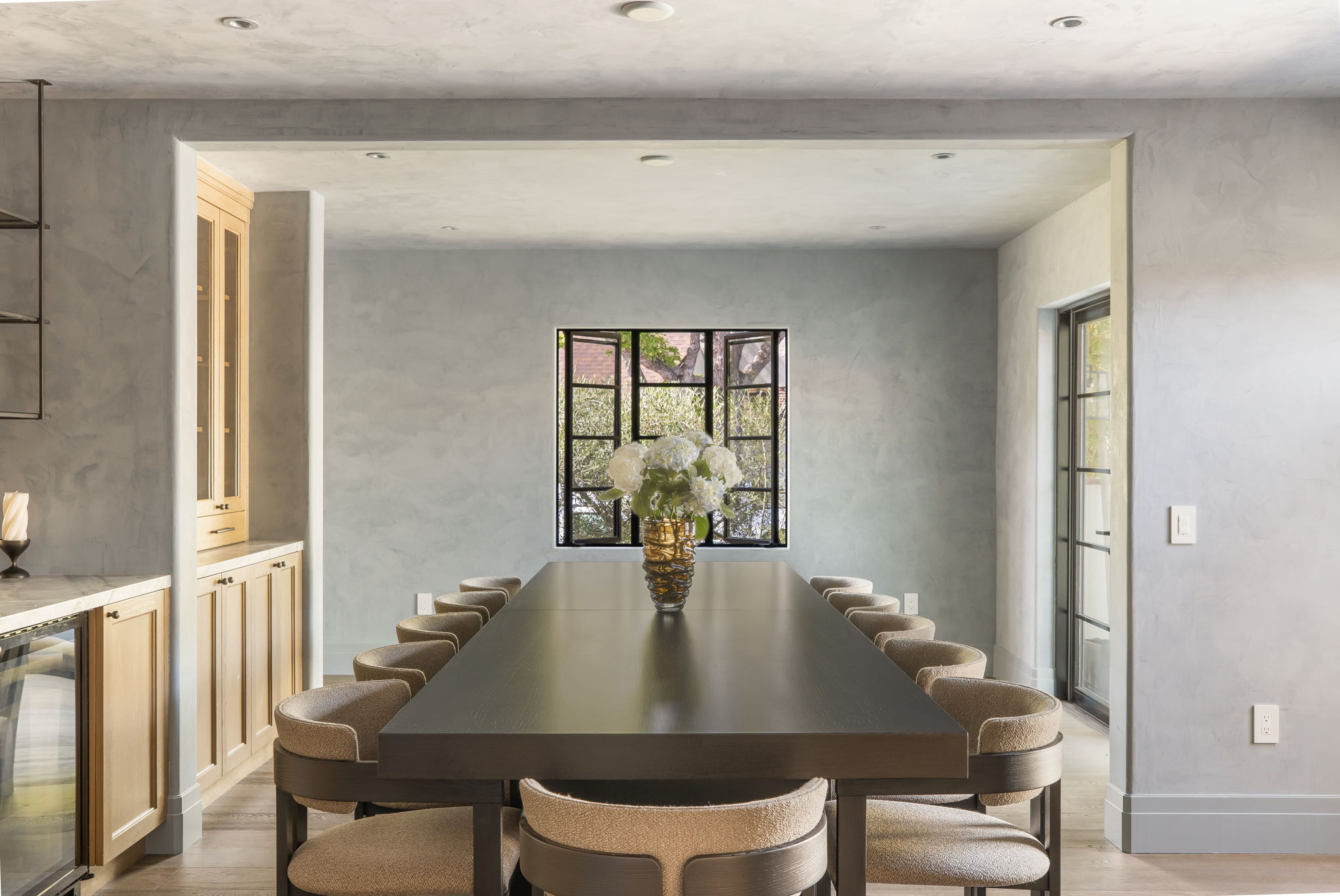 Slate & Sky dining room centered on steel-framed window