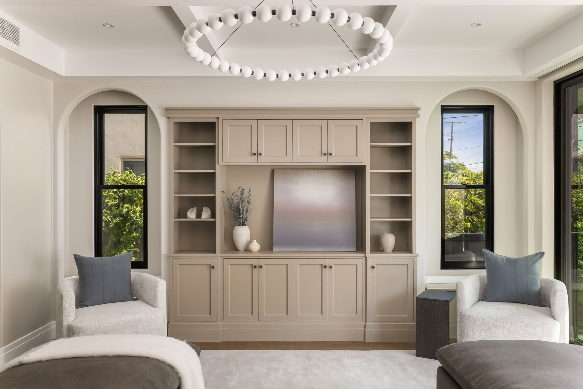 Slate & Sky family room built-in media wall with arched windows