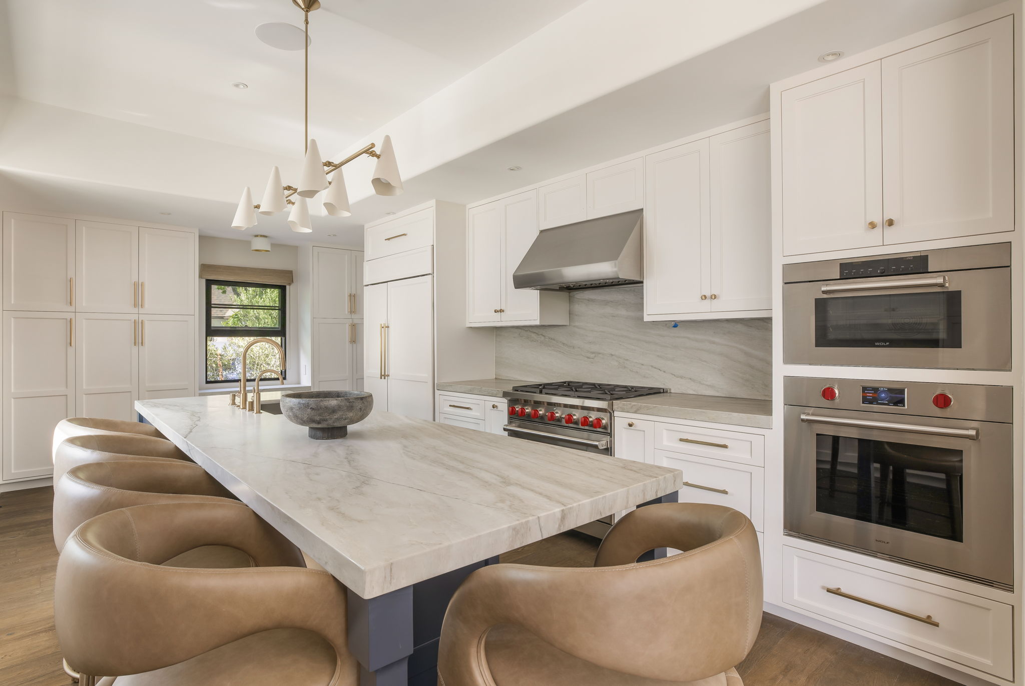 Slate & Sky kitchen with marble backsplash and brass hardware