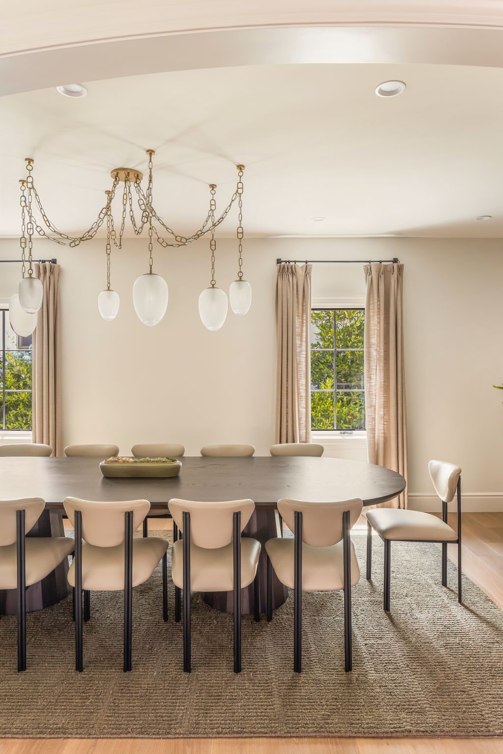 Storybook House dining room with brass chain chandelier