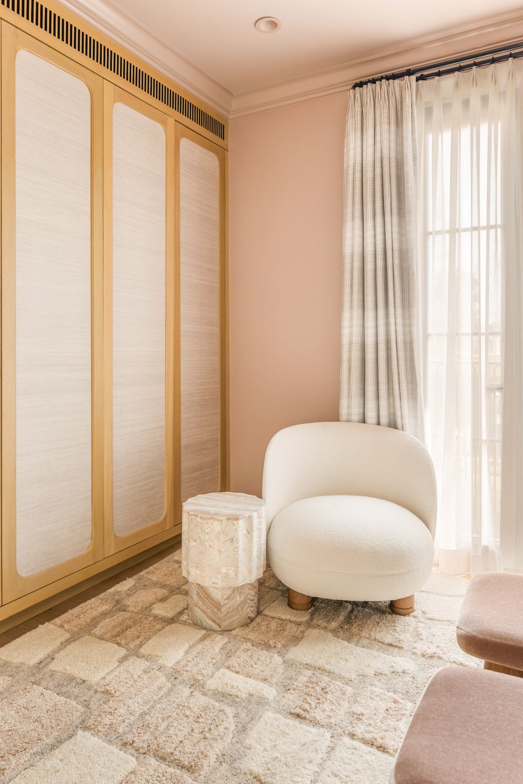 The Thistle House bedroom corner with boucle chair