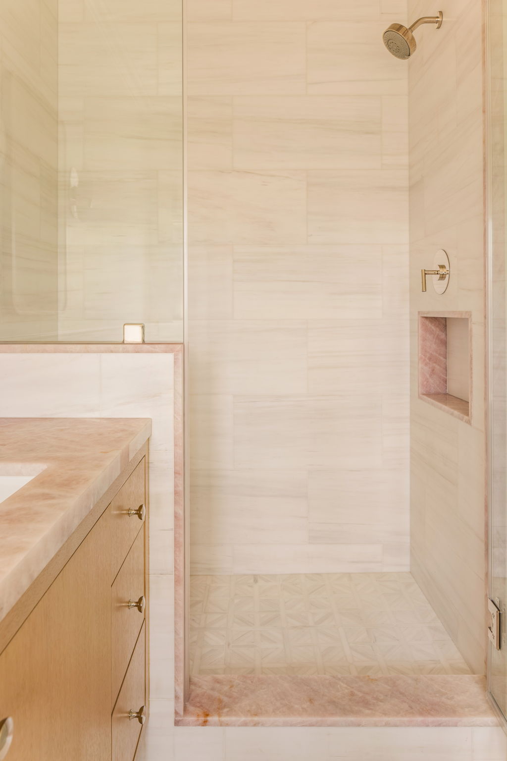 The Thistle House guest bath shower with pink onyx niche