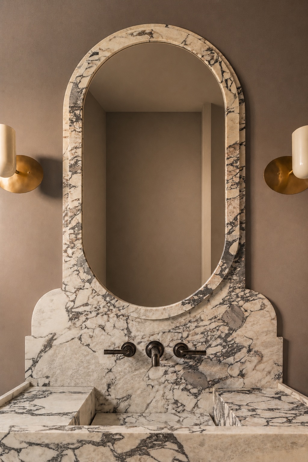 The Thistle House powder room arched marble mirror and brass sconces