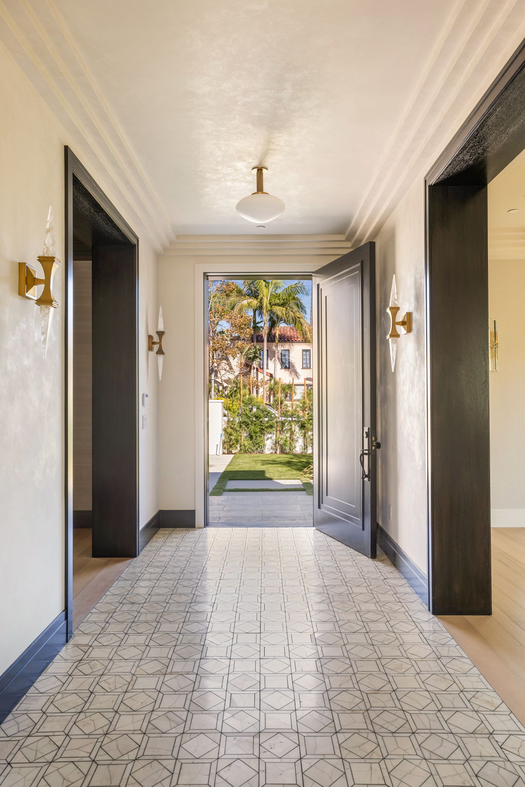 The Verdigris House entry hallway with patterned marble floor