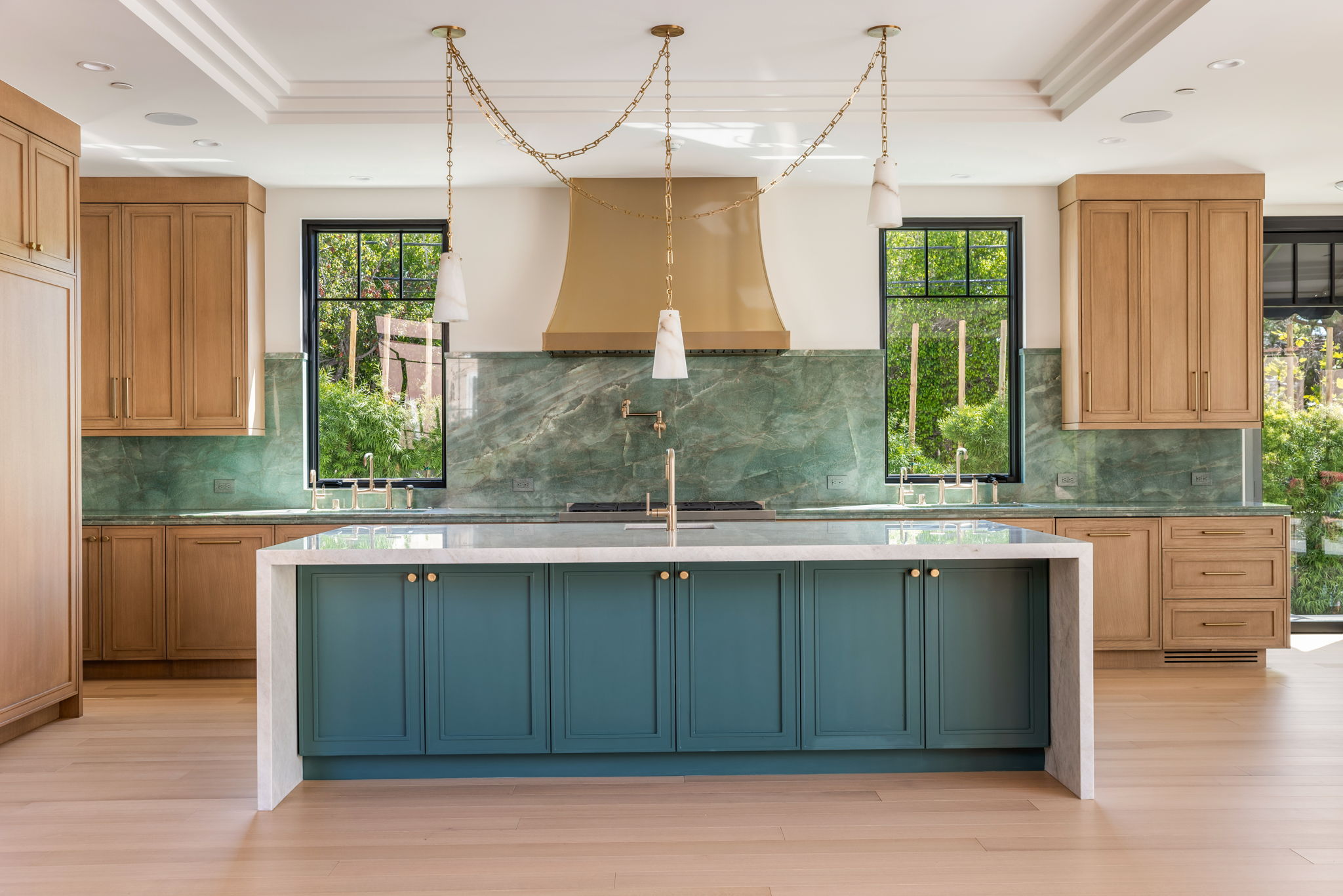 The Verdigris House kitchen hood with brass swag chain lighting